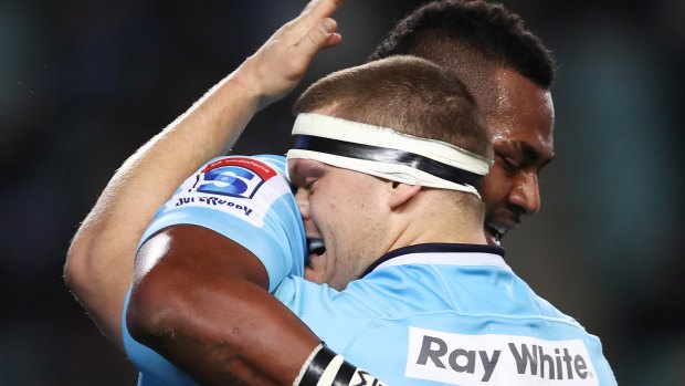 Try-fest: Taqele Naiyaravoro celebrates with Tom Robertson after his score.