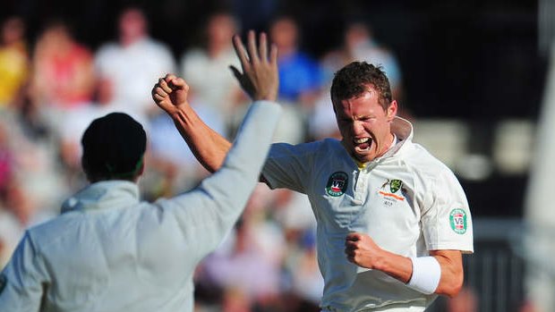 Australia's Peter Siddle (right) celebrates claiming the first wicket of England's innings, of Joe Root, late on day two of the third Ashes Test.