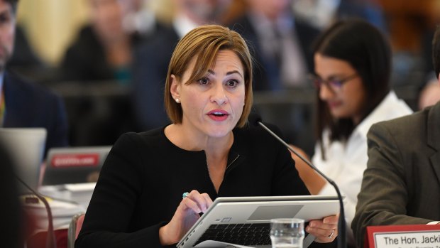 Queensland Deputy Premier Jackie Trad says her 10-year-old son was aggressively questioned by a 'claim farmer' who called her home.