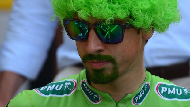 Slovakia's Peter Sagan is seen leaving the signature ceremony, and wearing a green wig, with his beard tinted in green to celebrate his green jersey of best sprinter, in Versailles.