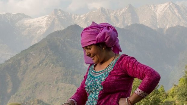 Women prepare a field for sowing corn in Dharmsala, India.