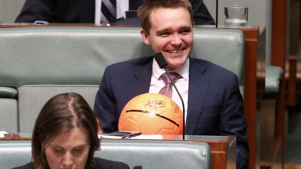 Liberal MP Wyatt Roy with Bert van Manen's ball in question time on Tuesday.