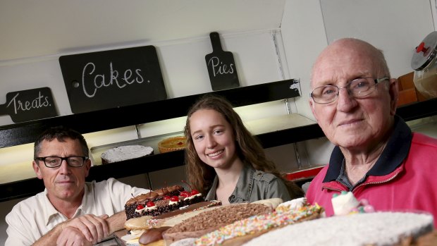 Bittersweet: Brett O'Callaghan, left, owner of soon to close Wild Holly Cakes, with daughter Rachael, who works there, and father Brian, who bought the shop in 1956.  