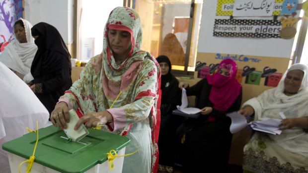 A Pakistani woman casts her vote at a polling station for the parliamentary elections in Islamabad on Wednesday.