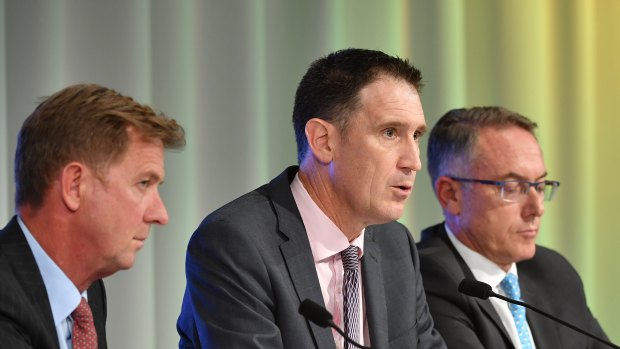 Done deal: Cricket Australia chief James Sutherland (centre) with Seven's Tim Worner and Foxtel's Patrick Delaney.