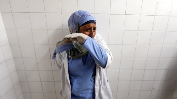 A colleague of Palestinian Razan Al-Najar reacts after hearing of the 21-year-old nurse's death. 
