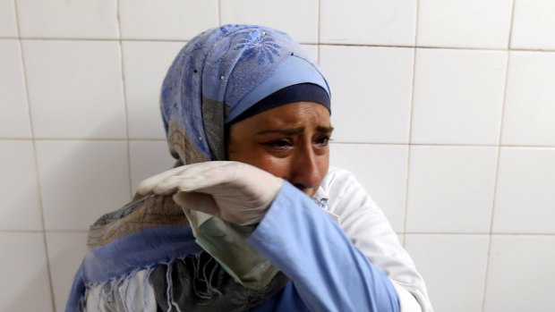 A colleague of Palestinian Razan Al-Najar reacts after hearing of the 21-year-old nurse's death. 