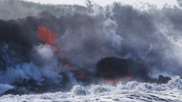 Lava flows into the ocean near Pahoa, Hawaii.