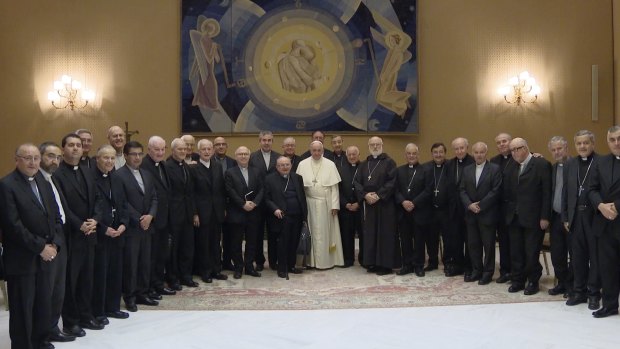 Pope Francis, centre, poses for a picture with Chilean Bishops during a meeting at the Vatican. 