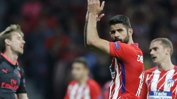 Moving on: Diego Costa, who score the decisive goal, applauds the crowd.