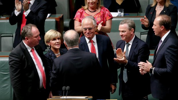 Treasurer Scott Morrison is congratulated by his colleagues after he delivered the budget speech on Tuesday.