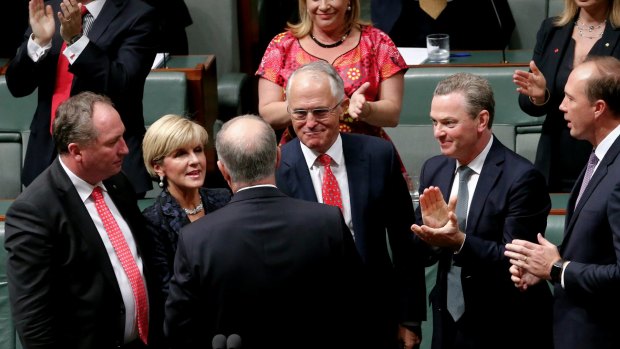 Treasurer Scott Morrison is congratulated by his colleagues after he delivered the budget speech on Tuesday.