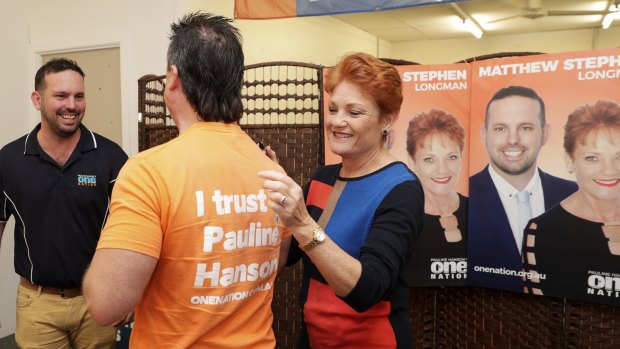 One Nation supporter Paul Henselim has his campaign t shirt signed by One Nation leader Pauline Hanson in Caboolture, Queensland, on Wednesday.