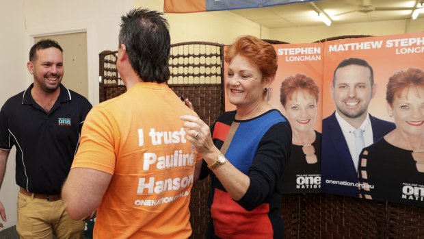 One Nation supporter Paul Henselim has his campaign t shirt signed by One Nation leader Pauline Hanson in Caboolture, Queensland, on Wednesday.