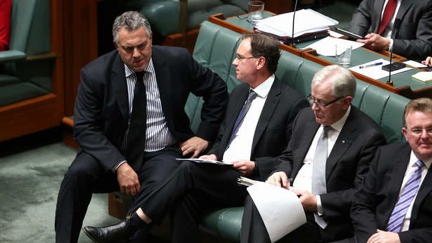 Treasurer Joe Hockey and Environment Minister Greg Hunt in discussion during QT. Photo: Alex Ellinghausen