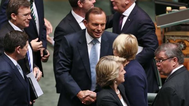 Prime Minister Tony Abbott shakes hands with Labor MP Jenny Macklin after delivering the Closing the Gap report.  Photo: Alex Ellinghausen