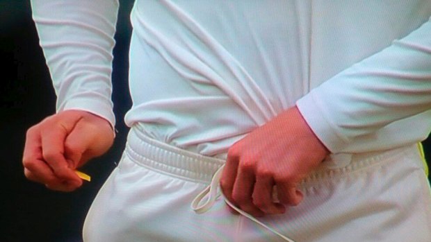 Tale of the 'tape': Cameron Bancroft puts the sandpaper down his pants.
