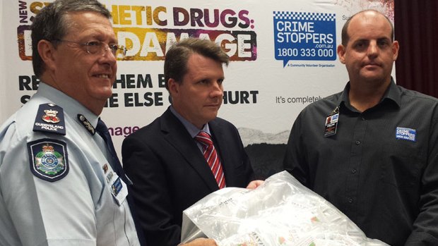 Commissioner Ian Stewart, Dr Christian Rowan and Crime Stoppers chief executive Trevor O'Brien.
