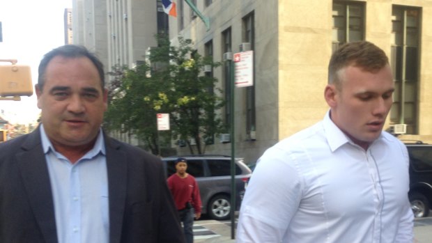 Matthew Lodge with his father in New York for a court appearance in 2015. 