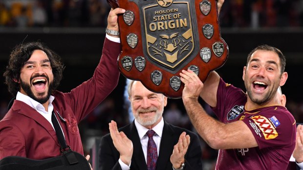 Photo bomb: Johnathan Thurston and Cameron Smith's big moment features John Grant, as well.
