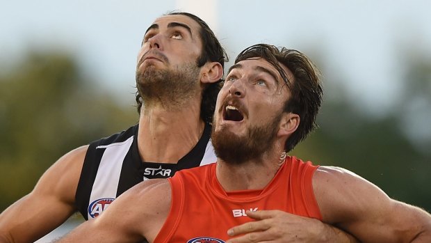 GOLD COAST, AUSTRALIA - MAY 23:  Charlie Dixon of the Suns and Brodie Grundy of the Magpies compete for the ball during the round eight AFL match between the Gold Coast Suns and the Collingwood Magpies at Metricon Stadium on May 23, 2015 in Gold Coast, Australia.  (Photo by Matt Roberts/Getty Images)