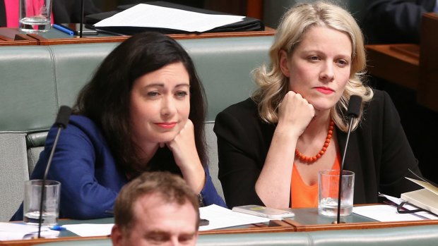 Labor MPs Terri Butler and Clare O'Neil listen as Prime Minister Malcolm Turnbull speaks during question time on Monday.