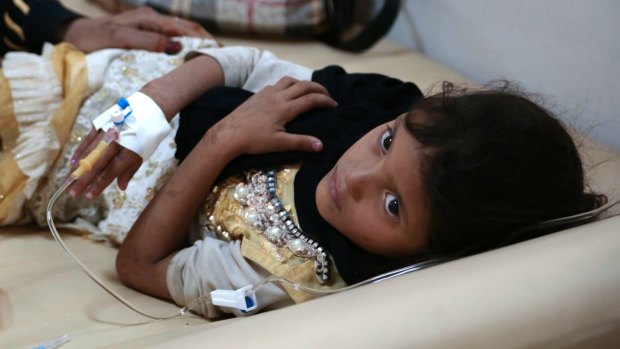 A girl is treated for a suspected cholera infection at a hospital in Sanaa, Yemen, in July. 