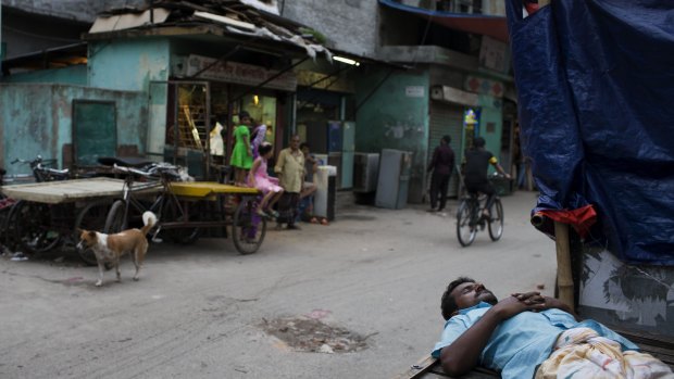 A man sleeps on a cart at Mohammadpur Geneva camp where over 100 suspected drug peddlers were detained in a raid last week.