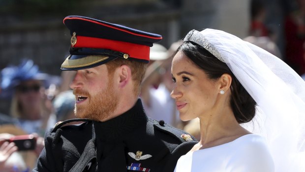Prince Harry and his wife Meghan leave after their wedding ceremony, at St. George's Chapel in Windsor Castle last Saturday.
