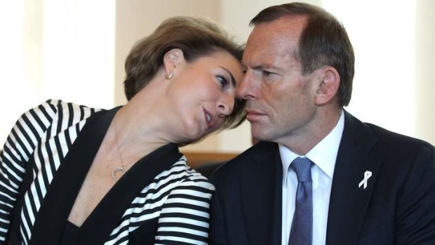 Senator Michaelia Cash speaks with Prime Minister Tony Abbott during the White Ribbon Day Breakfast at Parliament House. Photo: Alex Ellinghausen