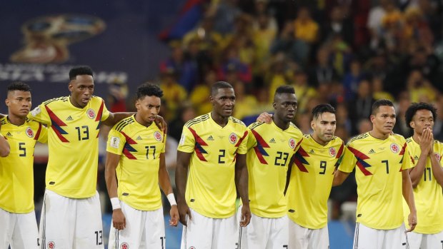 Colombia's players watch on during the penalty shootout against England.