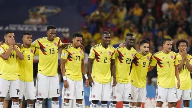 Colombia's players watch on during the penalty shootout against England.