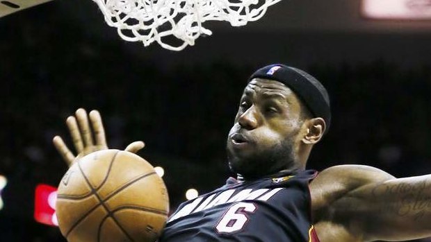 The King: Miami Heat's LeBron James dunks against the San Antonio Spurs during the third quarter in Game 4 of their NBA Finals basketball series in San Antonio.