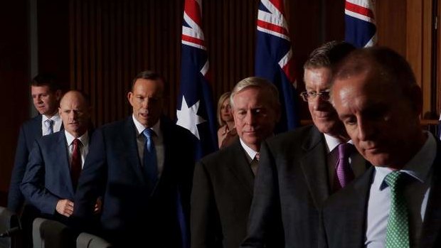 Prime Minister Tony Abbott with state premiers and chief ministers at the COAG press conference. Photo: Andrew Meares