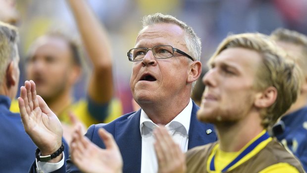 Sweden head coach Janne Andersson celebrates with his players after their win over Switzerland in the round of 16.