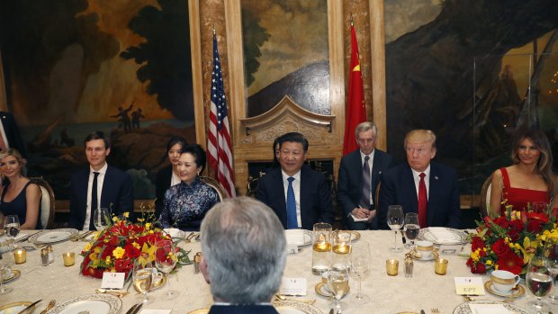 Famous company: Donald Trump and Chinese President Xi Jinping, with their wives, first lady Melania Trump and Chinese first lady Peng Liyuan, Ivanka Trump, and her husband, White House senior adviser Jared Kushner, left, at dinner at Mar-a-Lago last year. 