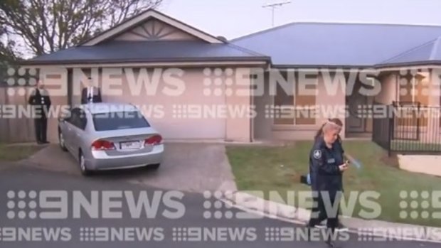 The Kuraby home being searched by police.