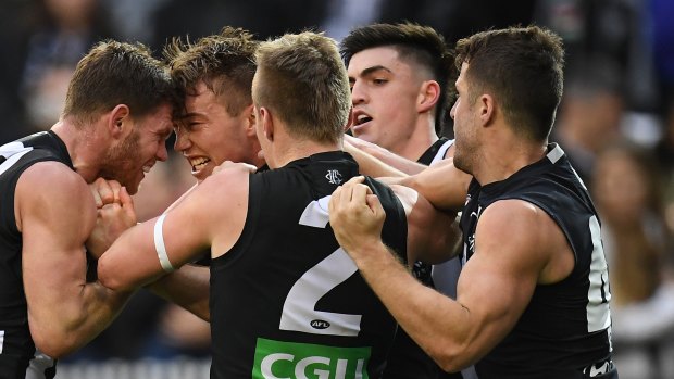 Scuffle: Collingwood's Taylor Adams and Carlton's Patrick Cripps go head-to-head as tempers flare at the 'G.