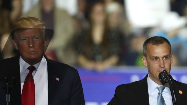 US President Donald Trump, left, watches as Corey Lewandowski speaks during a campaign rally in 2016.