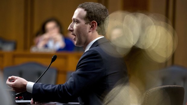Facebook CEO Mark Zuckerberg testifies before a joint hearing of the Commerce and Judiciary Committees on Capitol Hill in Washington on Tuesday about the use of Facebook data to target American voters.