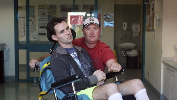 Matt Pridham with his father David in the Brains Injury Unit at Liverpool Hospital in Sydney.