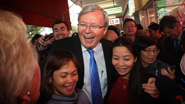Nothing but blue ties: Kevin Rudd mobbed by fans in Hurstville.
