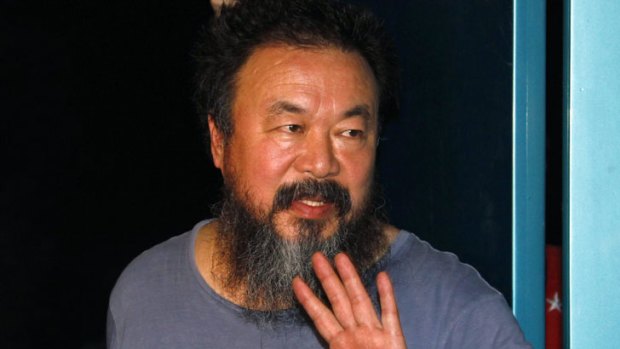 Dissident Chinese artist Ai Weiwei speaks to the media after being released on bail in Beijing.