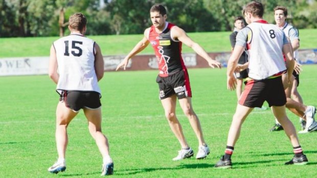 Leigh Montagna (centre) trains at Moorabbin Oval on Sunday.