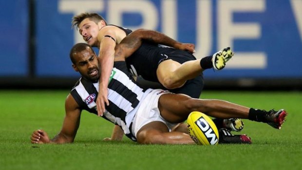 Collingwood's Heritier Lumumba, seen here in a tangle with Carlton's Andrejs Everitt, has met Melbourne coach Paul Roos about a move to the Demons.