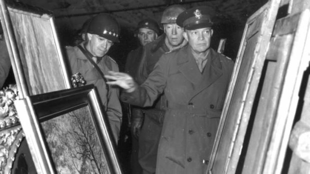 General Dwight D. Eisenhower, center, inspects paintings in a salt mine at Merkers, Germany, where the Nazi government stored art treasures plundered in occupied countries in this April 12, 1945 file photo.