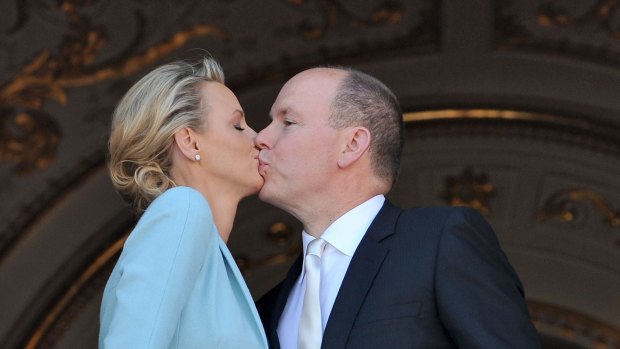 Princess Charlene of Monaco and Prince Albert II of Monaco kiss on the balcony after the civil ceremony of the Royal Wedding of Prince Albert II of Monaco to Charlene Wittstock at the Prince's Palace on July 1, 2011, in Monaco.