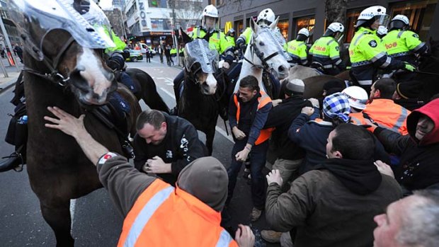 Police and striking workers clash during a CFMEU strike at the Myer/Grocon site in central Melbourne last year.