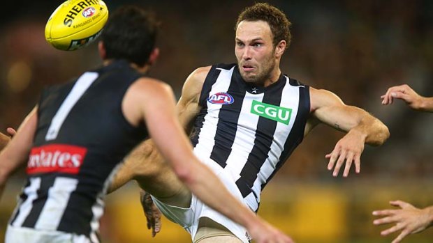 Collingwood's Brent Macaffer has eyes only for the ball.