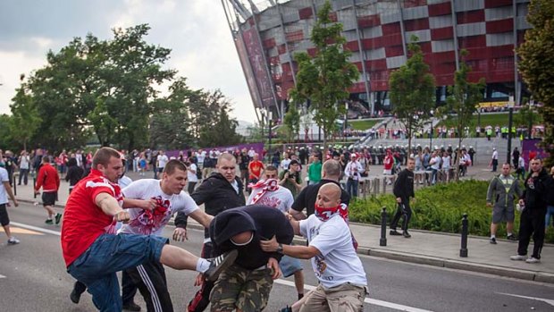 Fight ... Polish and Russian football fans clash.